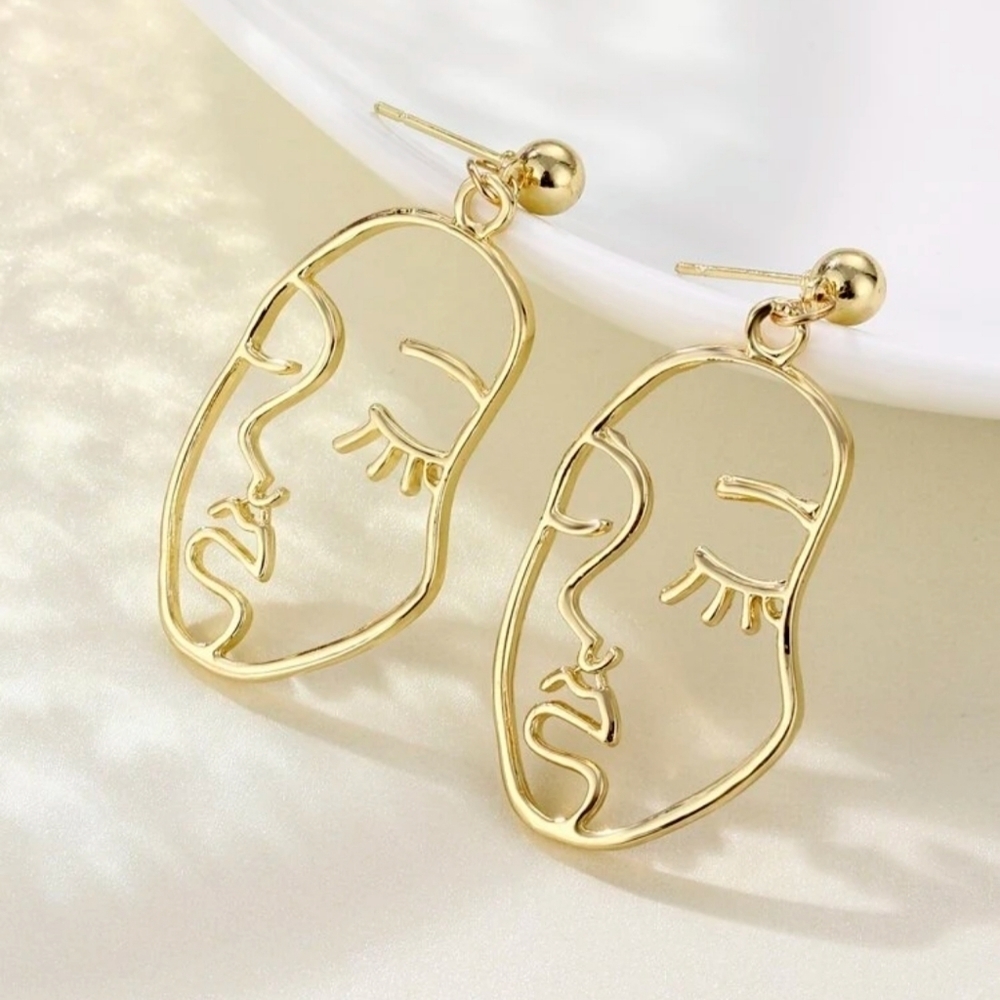 3/$30 abstract hollow gold face earrings